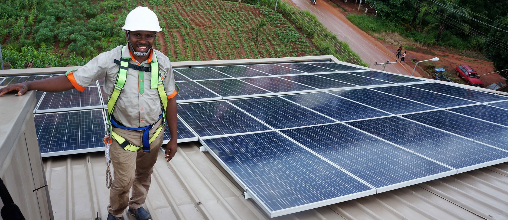 Cleanergy solar engineer installing rooftop panels in Nigeria